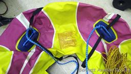 Pull behind Ski Tube II boating tube has hand pump and includes tow rope. Tube is 48" round.