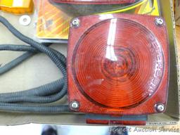 Two stop and turn taillights ( one is NIP), side marker lights, taillight lenses, more.