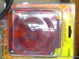Two stop and turn taillights ( one is NIP), side marker lights, taillight lenses, more.
