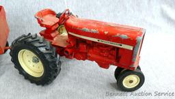 Ertl International tractor with No. 1349 wagon. Tractor with wagon is approx. 18" long.