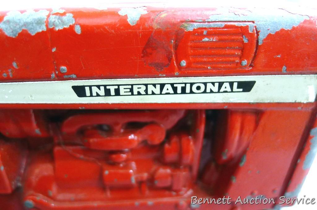Ertl International tractor with No. 1349 wagon. Tractor with wagon is approx. 18" long.