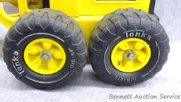 Tonka metal toy road grader is 18" x 7" x 7" tall. Wheels and blade rotate.