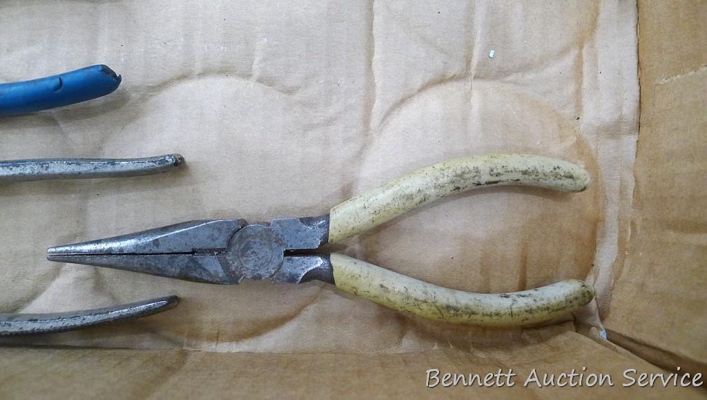 Pair of needle nose, regular, wire cutter pliers, hack saw and more.