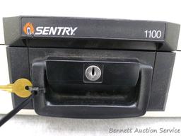 Sentry 1100 fire proof money safe; measures 14" x 10" x 6", looks new and comes with 1 key.