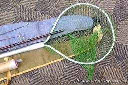 Fishing net and pole sections, 1989 Makita calendar, NRA paper targets, a handful of corroded