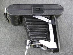 Vintage Kodak Vigilant Junior Six-20 camera is about 6-1/2" x 3-1/2" x 5-1/4" when unfolded. Looks
