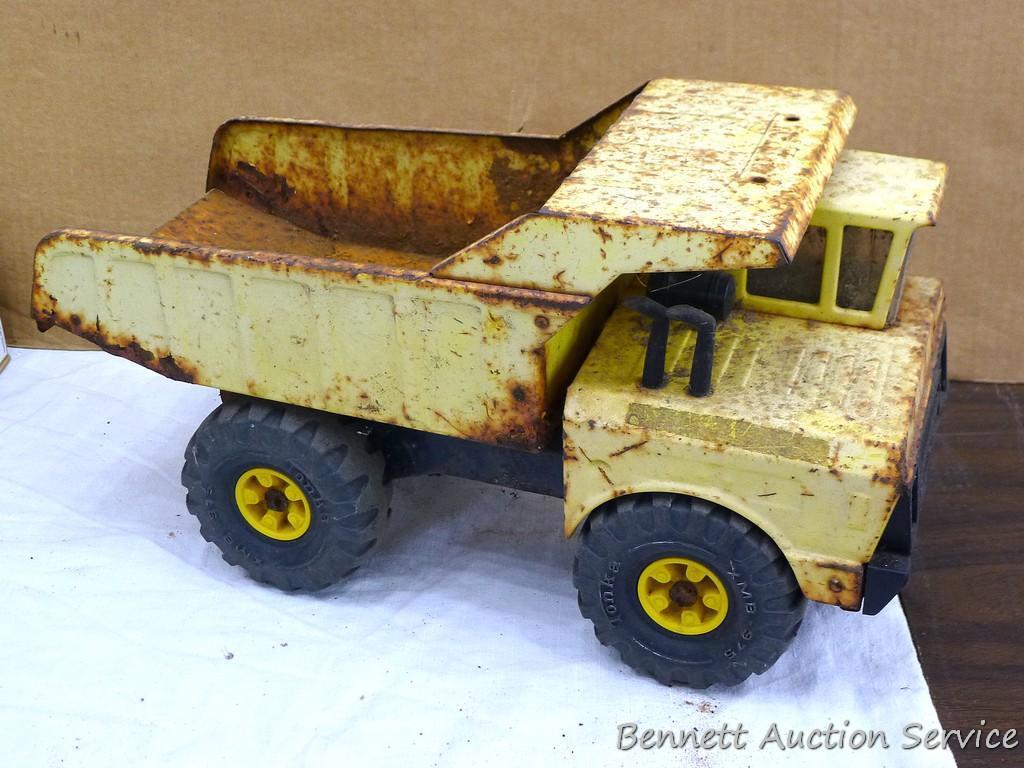 Tonka dump truck, and crane. Dump truck is approx 19" x 8" x 10". Lots of fun in a sandbox or the