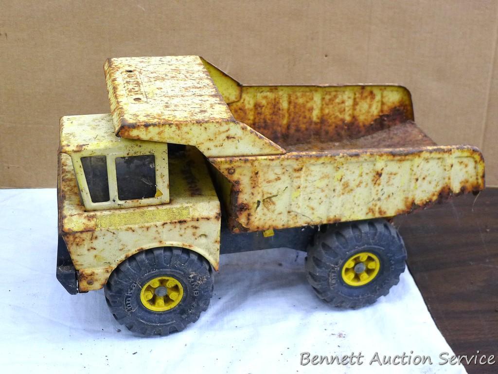 Tonka dump truck, and crane. Dump truck is approx 19" x 8" x 10". Lots of fun in a sandbox or the