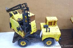 Tonka dump truck, and crane. Dump truck is approx 19" x 8" x 10". Lots of fun in a sandbox or the