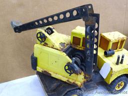 Tonka dump truck, and crane. Dump truck is approx 19" x 8" x 10". Lots of fun in a sandbox or the