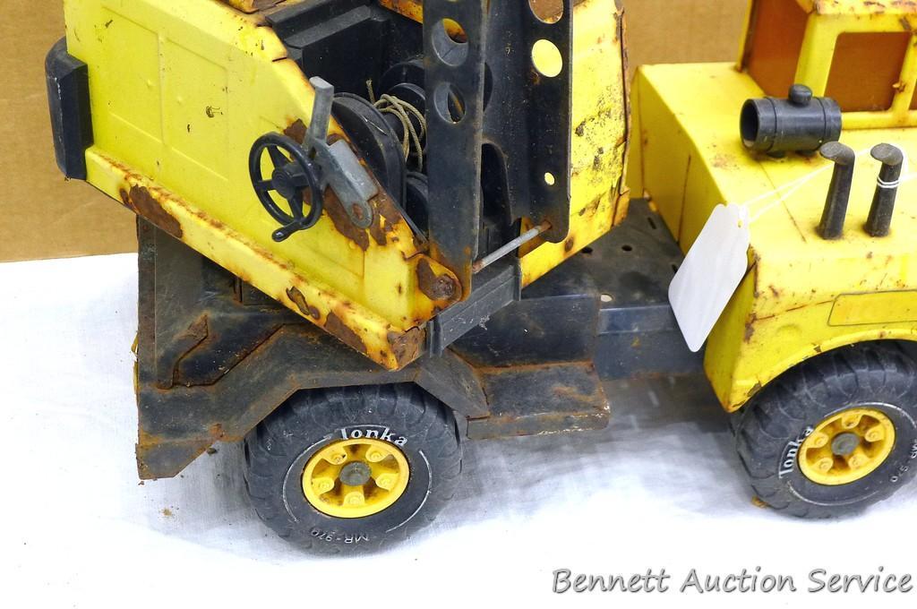 Tonka dump truck, and crane. Dump truck is approx 19" x 8" x 10". Lots of fun in a sandbox or the