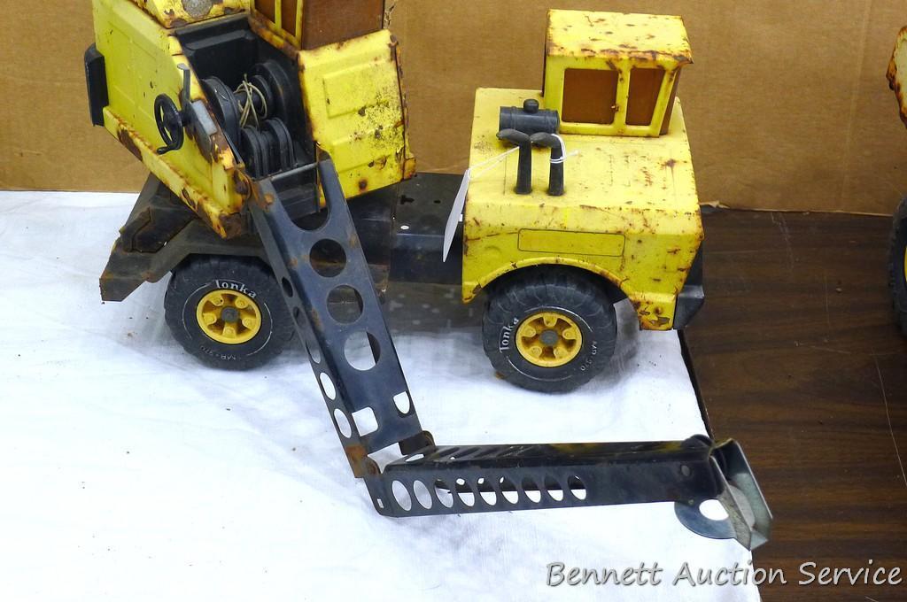 Tonka dump truck, and crane. Dump truck is approx 19" x 8" x 10". Lots of fun in a sandbox or the