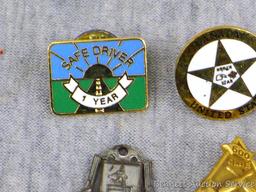 Assorted pins including American Presidential Task Force, NSA, NMA, more.