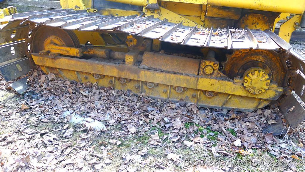 Watch the video. John Deere JD 350-B wide track dozer with 9 foot 6-way blade. Tracks are 32" wide.