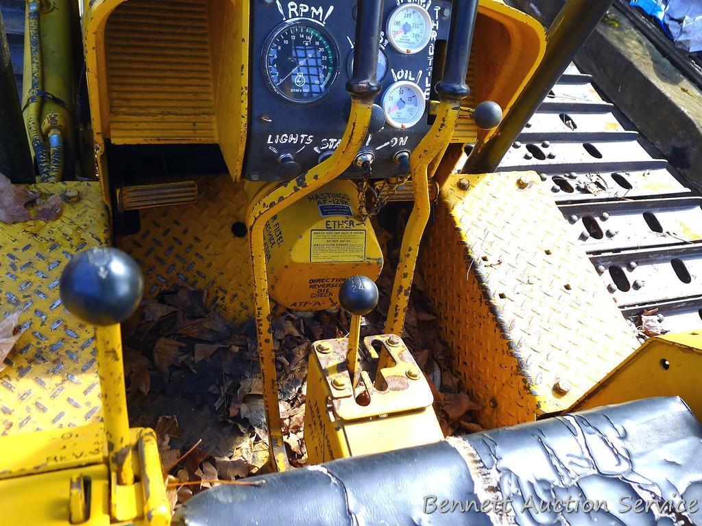 Watch the video. John Deere JD 350-B wide track dozer with 9 foot 6-way blade. Tracks are 32" wide.
