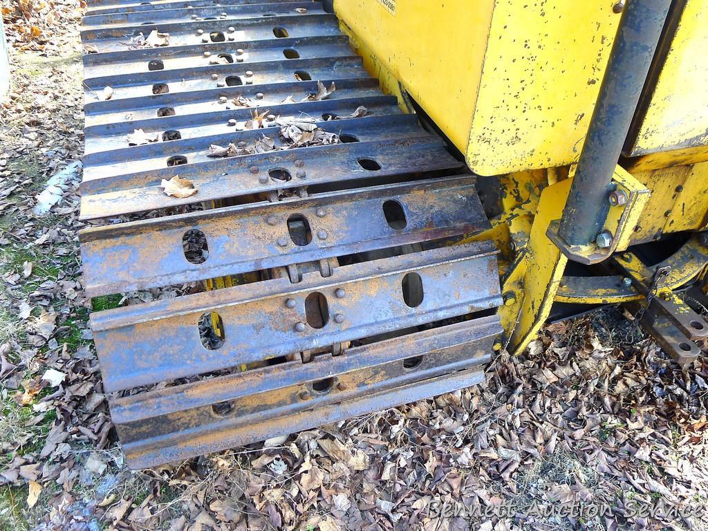 Watch the video. John Deere JD 350-B wide track dozer with 9 foot 6-way blade. Tracks are 32" wide.