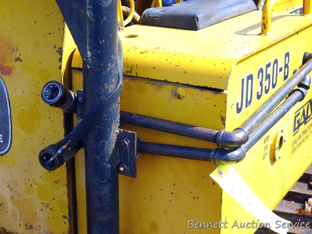 Watch the video. John Deere JD 350-B wide track dozer with 9 foot 6-way blade. Tracks are 32" wide.