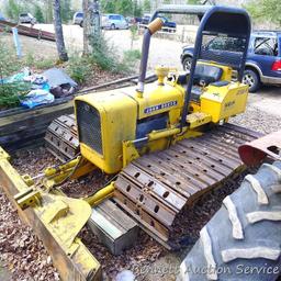 Watch the video. John Deere JD 350-B wide track dozer with 9 foot 6-way blade. Tracks are 32" wide.