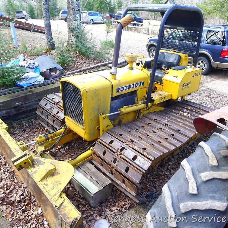 Watch the video. John Deere JD 350-B wide track dozer with 9 foot 6-way blade. Tracks are 32" wide.