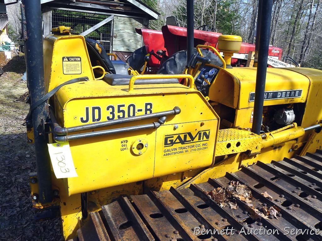 Watch the video. John Deere JD 350-B wide track dozer with 9 foot 6-way blade. Tracks are 32" wide.