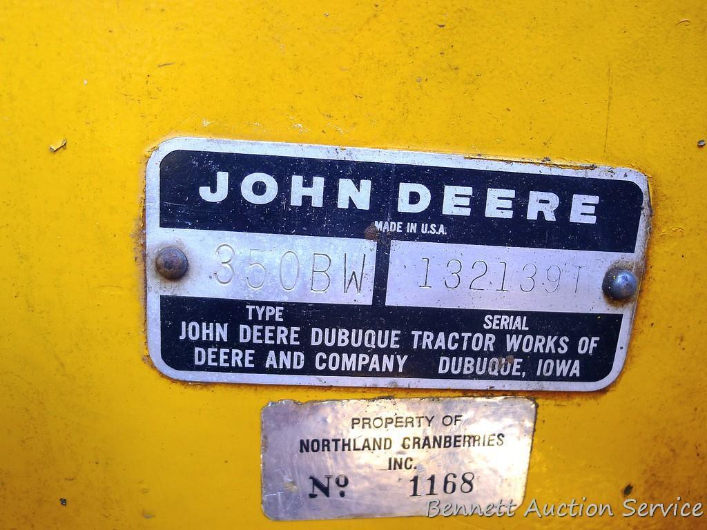 Watch the video. John Deere JD 350-B wide track dozer with 9 foot 6-way blade. Tracks are 32" wide.