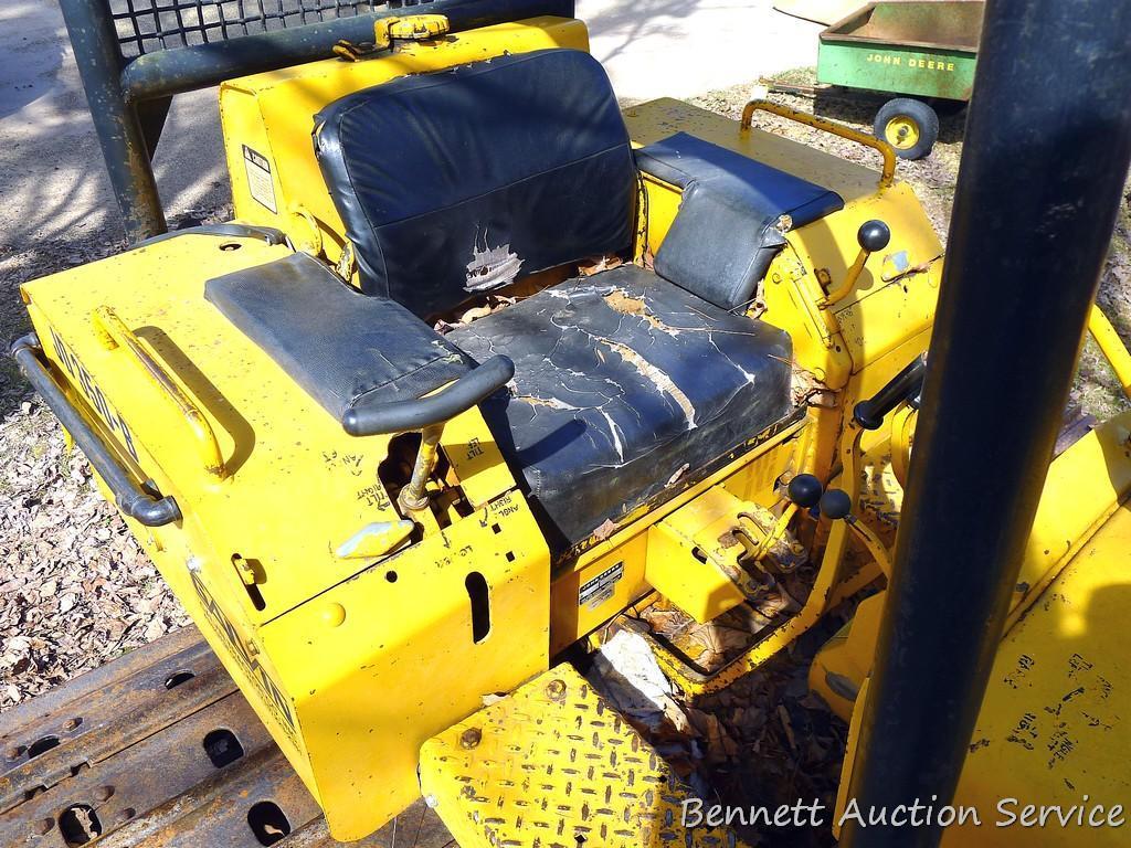 Watch the video. John Deere JD 350-B wide track dozer with 9 foot 6-way blade. Tracks are 32" wide.