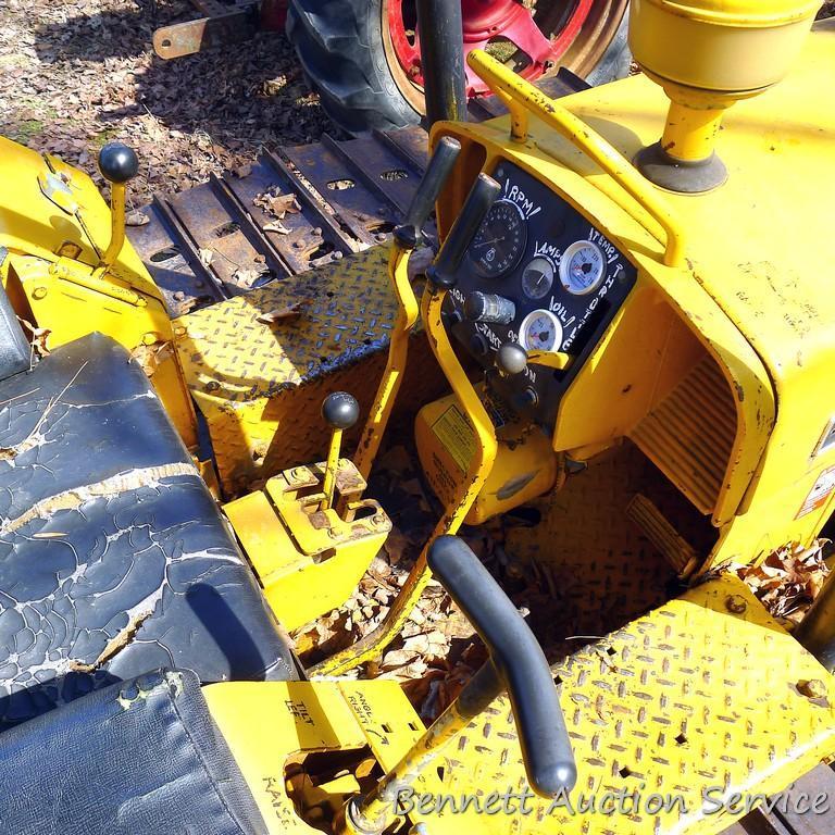 Watch the video. John Deere JD 350-B wide track dozer with 9 foot 6-way blade. Tracks are 32" wide.
