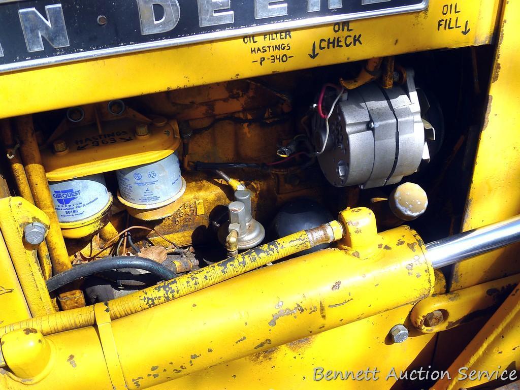 Watch the video. John Deere JD 350-B wide track dozer with 9 foot 6-way blade. Tracks are 32" wide.