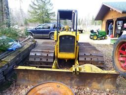 Watch the video. John Deere JD 350-B wide track dozer with 9 foot 6-way blade. Tracks are 32" wide.