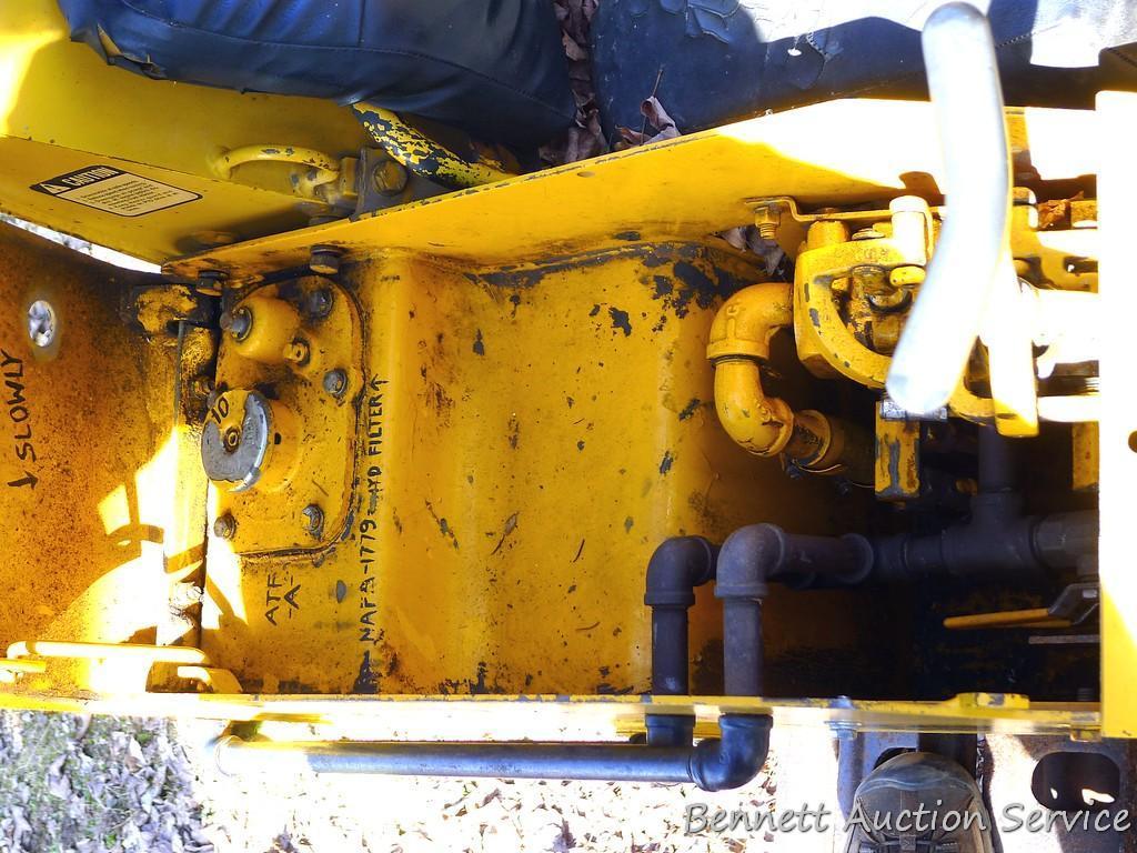 Watch the video. John Deere JD 350-B wide track dozer with 9 foot 6-way blade. Tracks are 32" wide.