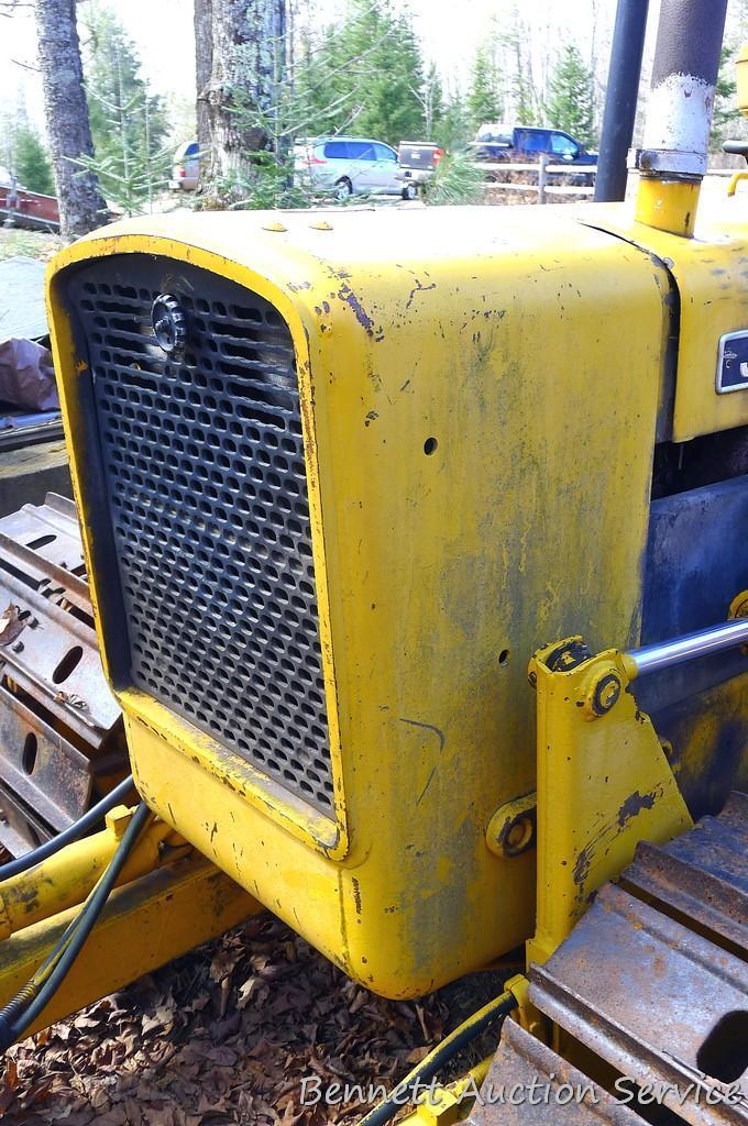 Watch the video. John Deere JD 350-B wide track dozer with 9 foot 6-way blade. Tracks are 32" wide.