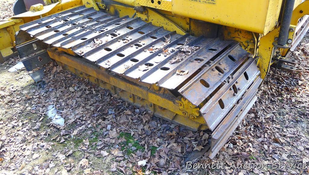 Watch the video. John Deere JD 350-B wide track dozer with 9 foot 6-way blade. Tracks are 32" wide.