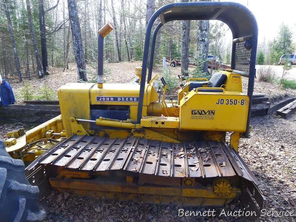 Watch the video. John Deere JD 350-B wide track dozer with 9 foot 6-way blade. Tracks are 32" wide.