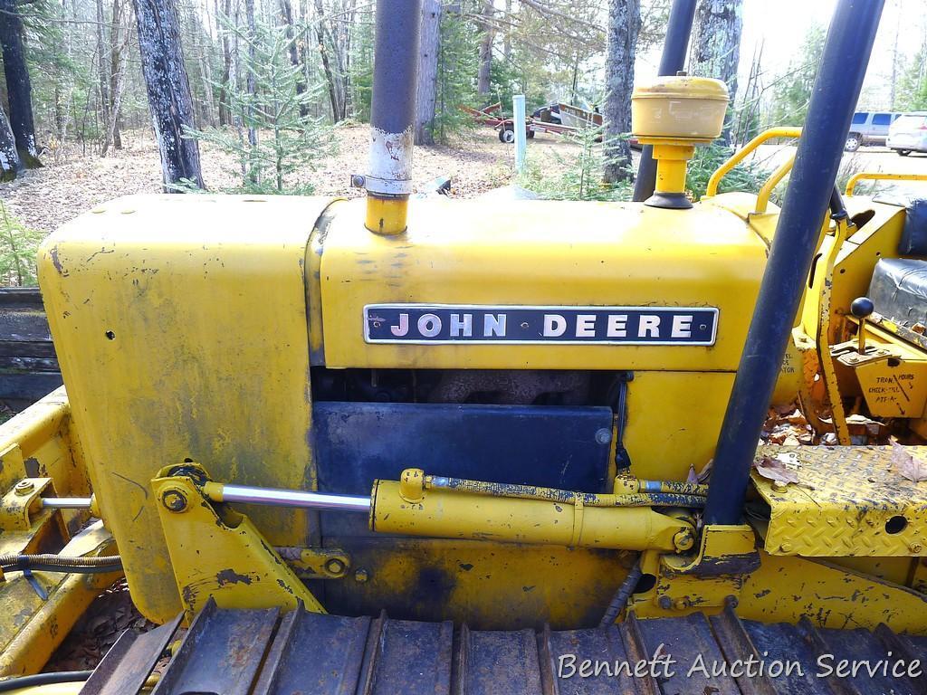 Watch the video. John Deere JD 350-B wide track dozer with 9 foot 6-way blade. Tracks are 32" wide.