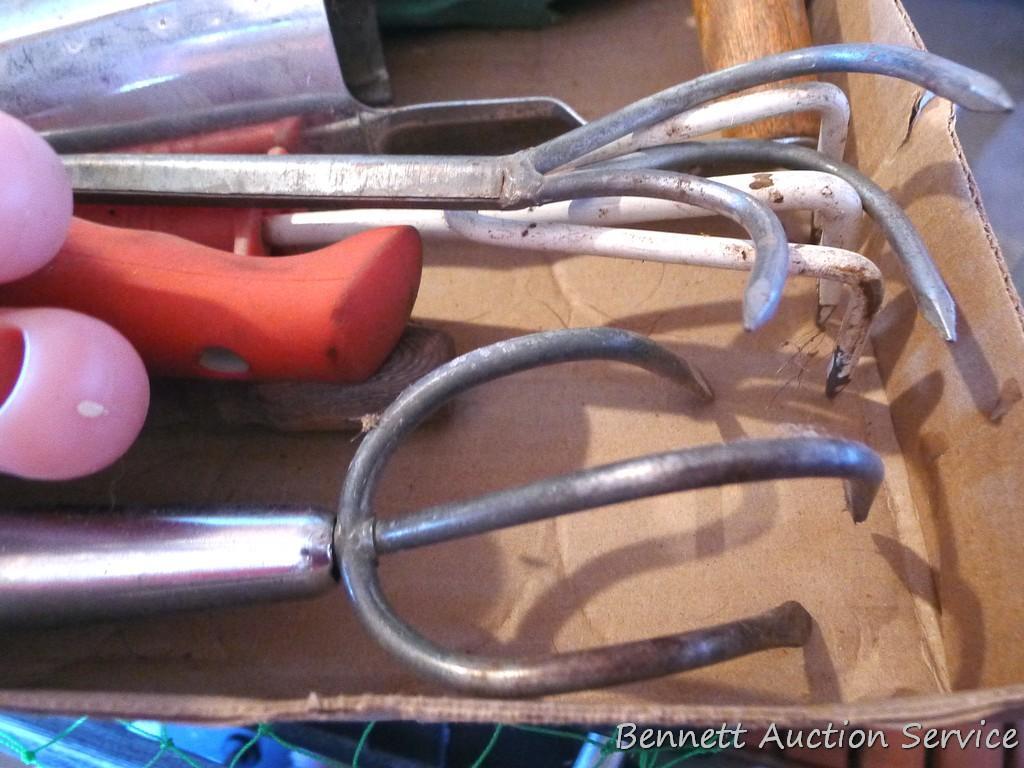 Spring is coming. Quantity of gardening tools including bulb planter.