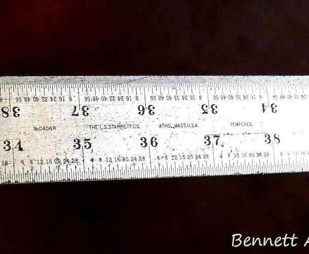Starrett No. C404R 6' steel rule shows plenty of use, but still looks straight when I eyeball down