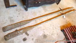 Pair of old boat oars are approx. 7' long. Both have pivots.