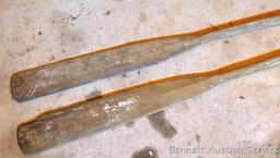 Pair of old boat oars are approx. 7' long. Both have pivots.