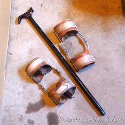 Leather and metal knee braces are old enough to decorate with. 34" cane has a slightly loose handle.