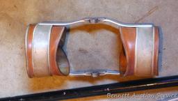 Leather and metal knee braces are old enough to decorate with. 34" cane has a slightly loose handle.