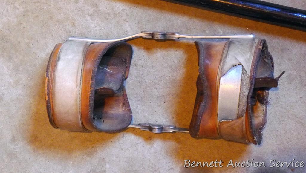 Leather and metal knee braces are old enough to decorate with. 34" cane has a slightly loose handle.