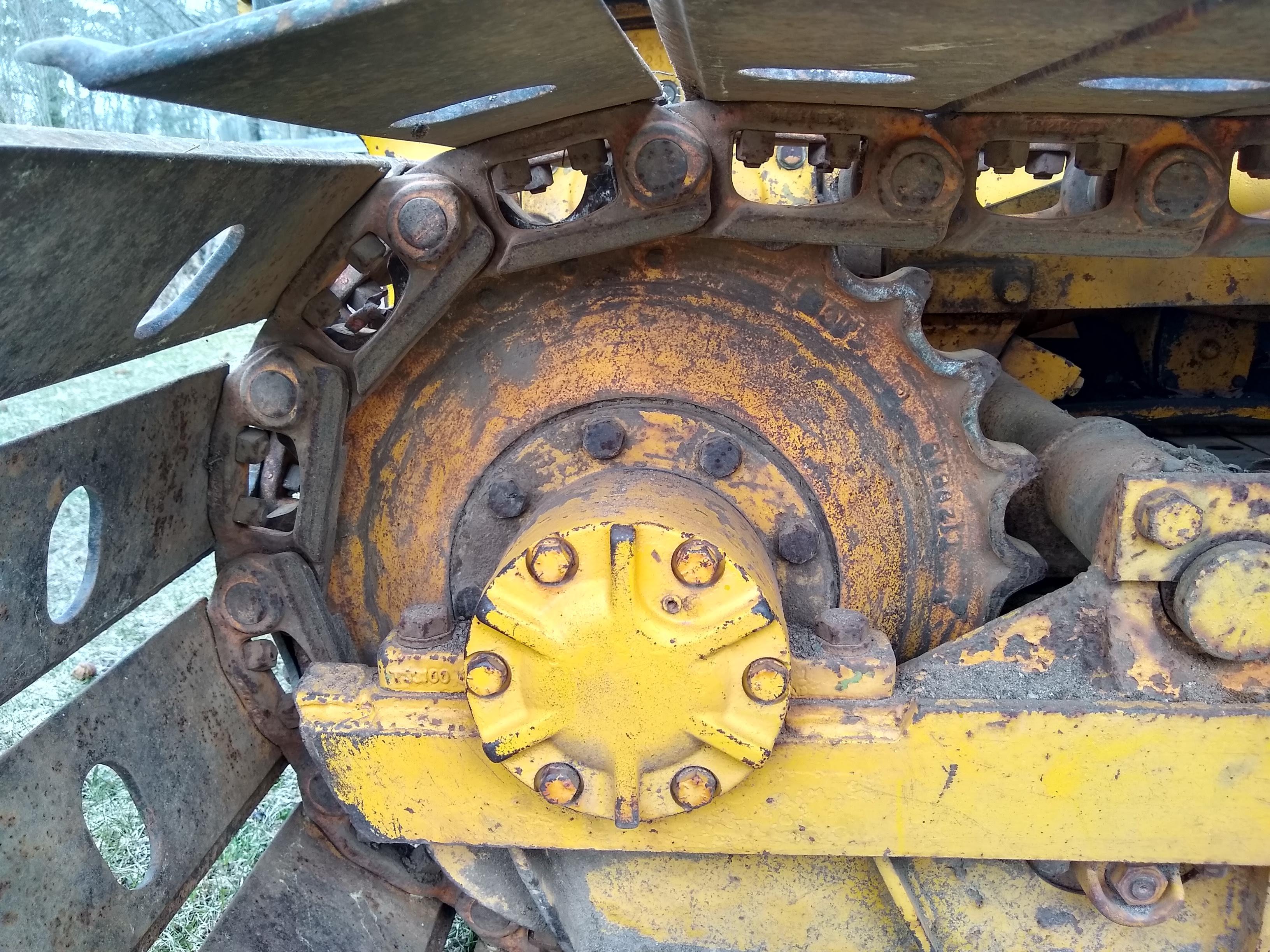 Watch the video. John Deere JD 350-B wide track dozer with 9 foot 6-way blade. Tracks are 32" wide.