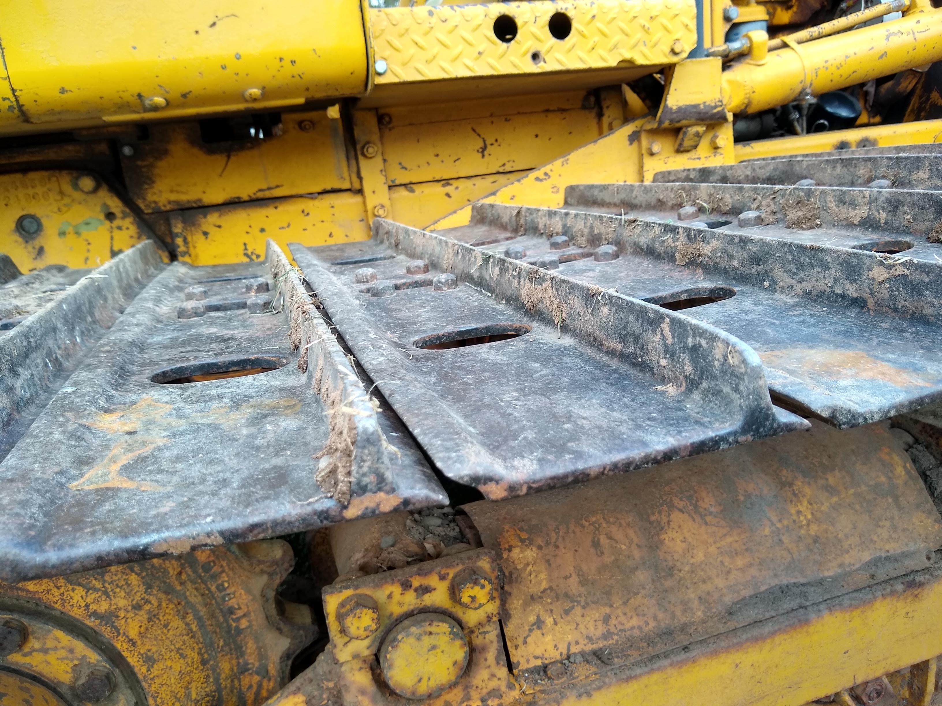 Watch the video. John Deere JD 350-B wide track dozer with 9 foot 6-way blade. Tracks are 32" wide.