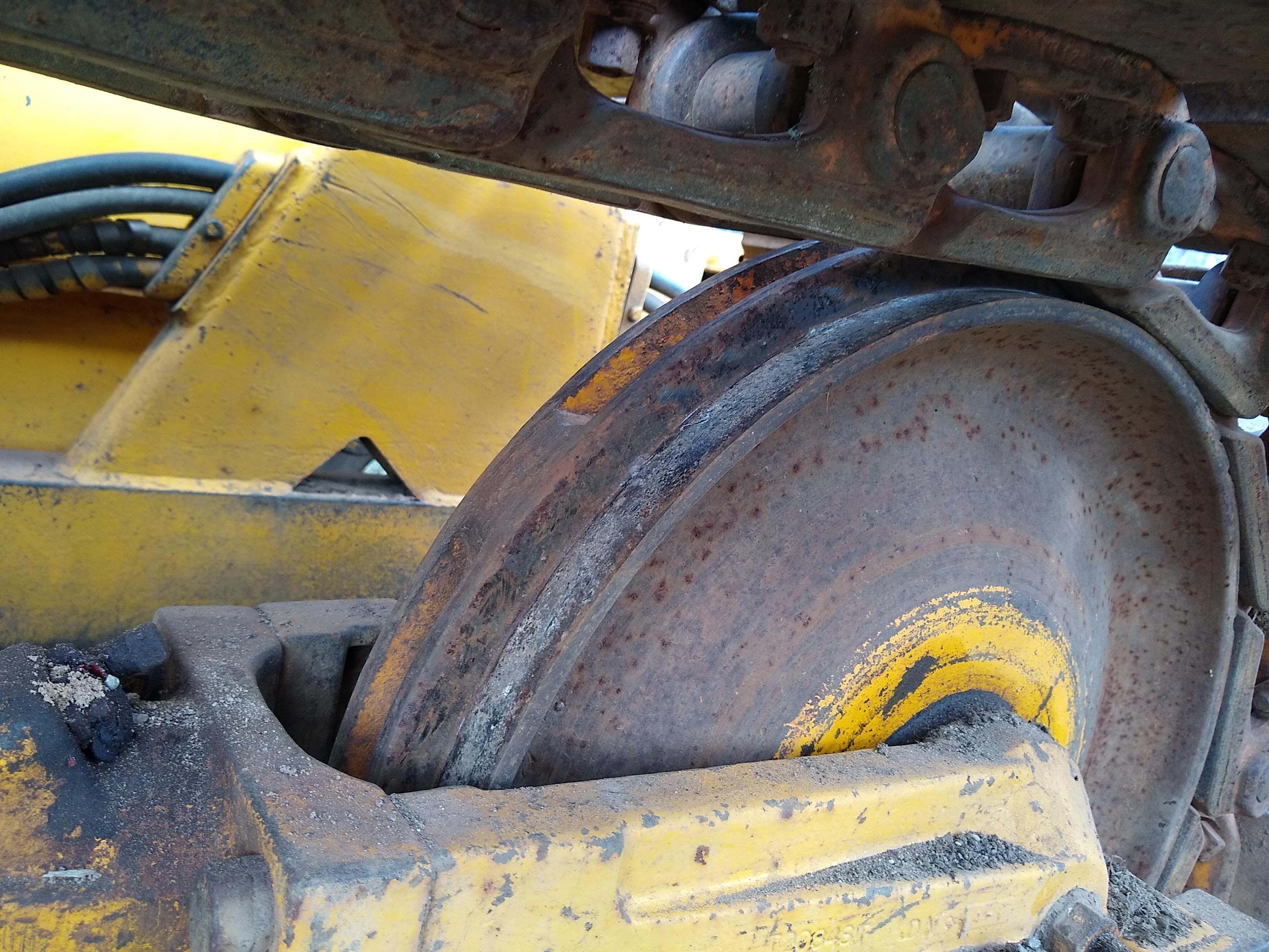 Watch the video. John Deere JD 350-B wide track dozer with 9 foot 6-way blade. Tracks are 32" wide.