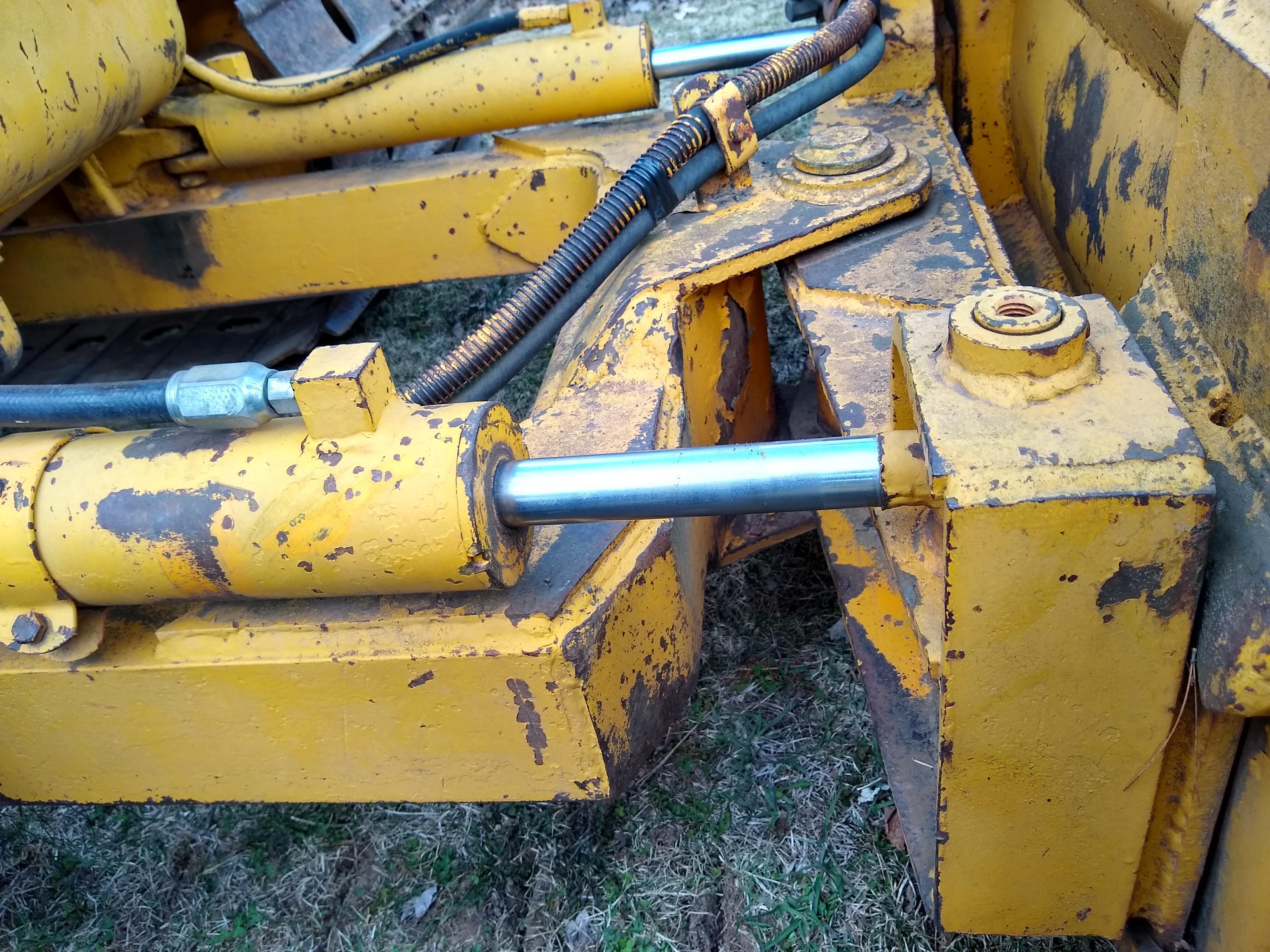 Watch the video. John Deere JD 350-B wide track dozer with 9 foot 6-way blade. Tracks are 32" wide.