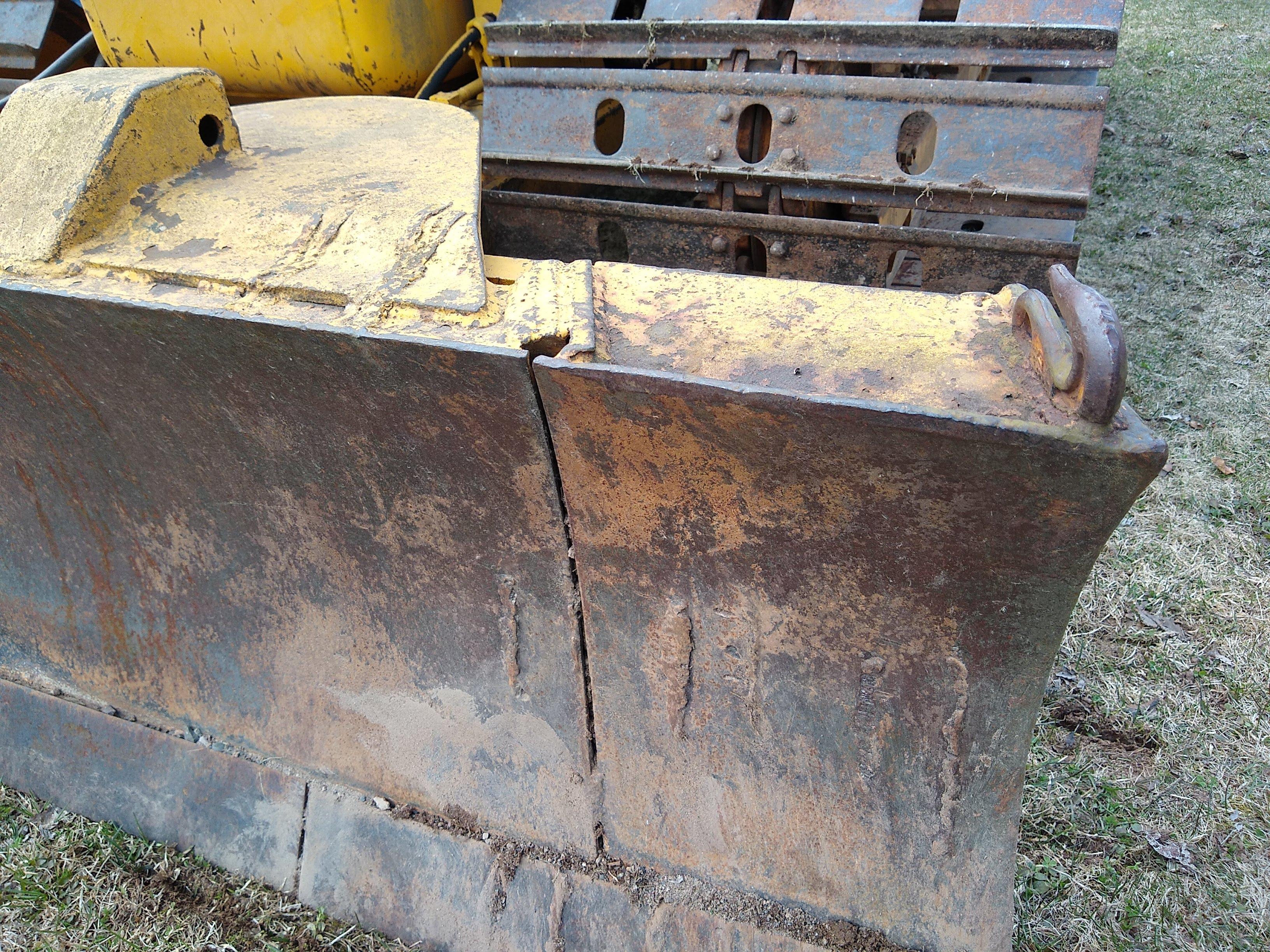 Watch the video. John Deere JD 350-B wide track dozer with 9 foot 6-way blade. Tracks are 32" wide.