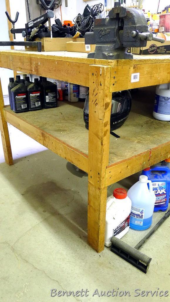 Heavy duty homemade work bench with lower shelf is 4' x 8' x 34-1/2" tall.