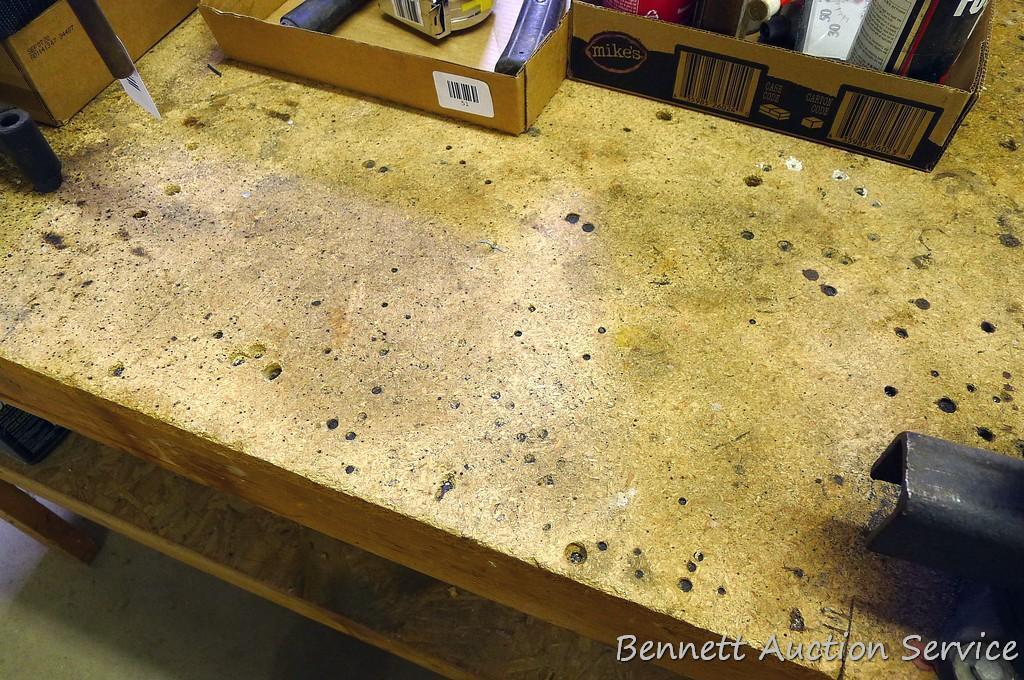 Heavy duty homemade work bench with lower shelf is 4' x 8' x 34-1/2" tall.