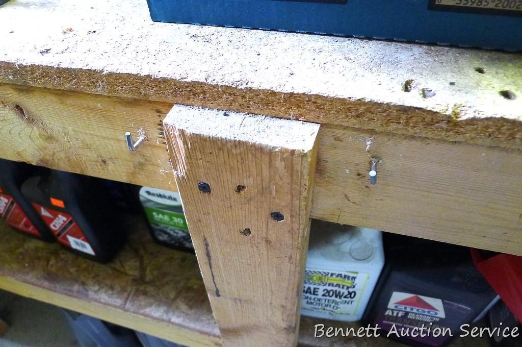 Heavy duty homemade work bench with lower shelf is 4' x 8' x 34-1/2" tall.