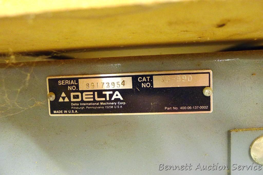 Delta Model 10 Deluxe Radial Arm Saw with Automatic Brake with single phase ball bearing motor. Has